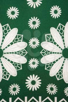 Royalty Free Photo of a Close-up of a Vintage Fabric With a White Daisy Pattern