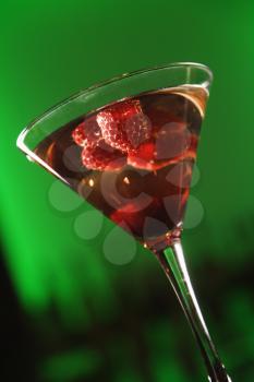 Royalty Free Photo of a Still Life of a Martini Cocktail With Raspberries 