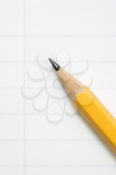 Royalty Free Photo of a Pencil on Notebook Paper