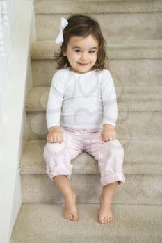 Royalty Free Photo of a Little Girl Sitting on the Stairs
