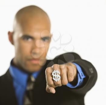 Royalty Free Photo of a Man Wearing a Dollar Sign Ring