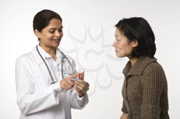 Royalty Free Photo of a Doctor Explaining Medication to a Patient 
