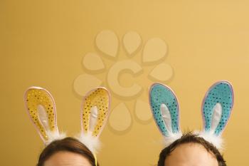 Royalty Free Photo of a Couple Wearing Rabbit Ears