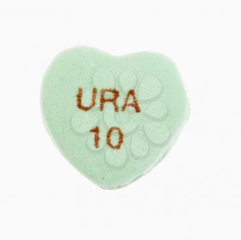 Green candy heart that reads URA 10 against white background.