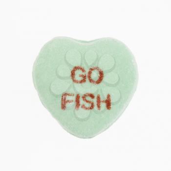 Royalty Free Photo of a Green Candy Heart That Reads Go Fish
