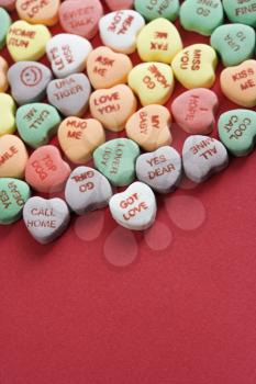 Royalty Free Photo of a Group of Colorful Candy Hearts with Sayings on Them