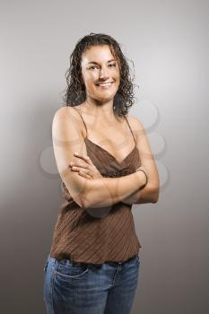Royalty Free Photo of a Woman With Arms Crossed Smiling