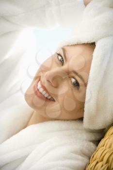Royalty Free Photo of a Woman Wearing a Towel on Her Head Smiling