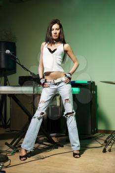Royalty Free Photo of a Woman Posing With Musical Equipment