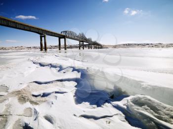 Royalty Free Photo of a Bridge Over Frozen Water in Midwestern USA
