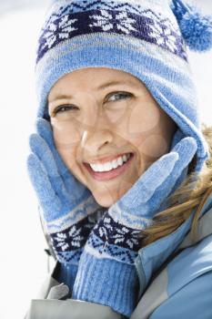 Royalty Free Photo of a Woman Wearing a Ski Hat and Gloves