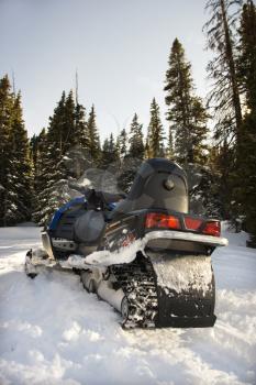 Royalty Free Photo of a Snowmobile in the Snow 