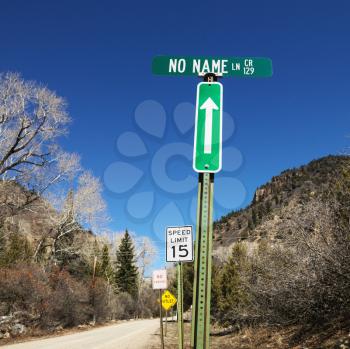 Royalty Free Photo of Several Street Signs Along Side the Road in Utah, USA
