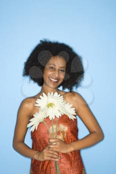 Royalty Free Photo of a a Woman Holding Flowers