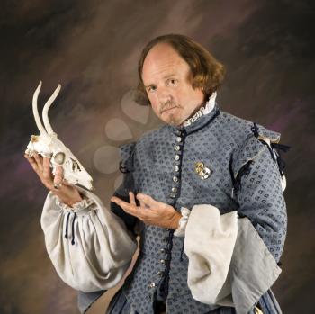 Royalty Free Photo of William Shakespeare in Holding a Deer Skull