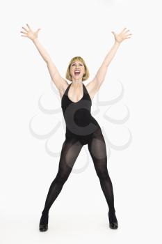 Royalty Free Photo of a Woman Standing Cheering With Happiness