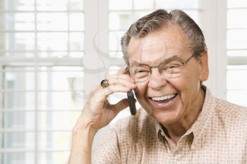 Royalty Free Photo of an Older Man Talking on a Cellphone