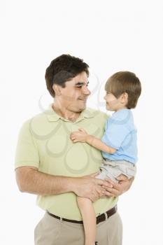 Royalty Free Photo of a Father Holding His Son