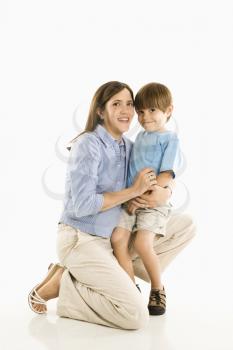 Royalty Free Photo of a Mother Kneeling Down Holding Her Son