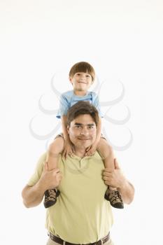 Royalty Free Photo of a Father Holding His Son on His Shoulders