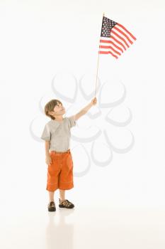 Royalty Free Photo of a Boy Waving an American Flag