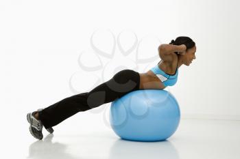 Royalty Free Photo of a Woman Working Out on an Exercise Ball