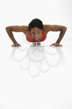 Royalty Free Photo of a Woman Doing a Push Up