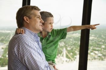 Royalty Free Photo of a Father and Son at the Observation Deck at Tower of the Americas in San Antonio, Texas