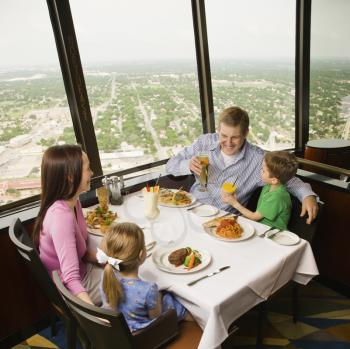 Royalty Free Photo of a Family Having Dinner Together at Tower of Americas restaurant in San Antonio, Texas