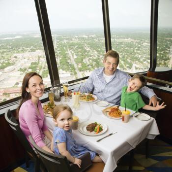 Royalty Free Photo of a Family Having Dinner Together at Tower of Americas Restaurant in San Antonio, Texas
