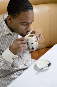 Royalty Free Photo of a Man Drinking Espresso
