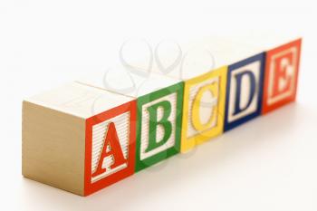 Royalty Free Photo of Alphabet Blocks Lined Up in a Row