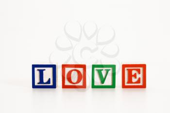 Alphabet toy building blocks spelling the word love.
