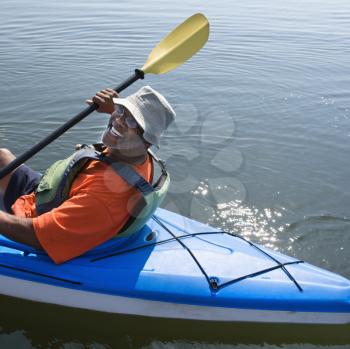 Royalty Free Photo of a Middle-aged Man Smiling in a Kayak