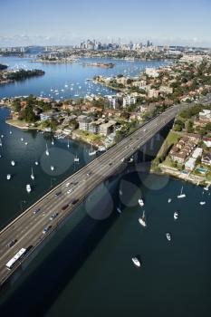 Royalty Free Photo of an Aerial View of Victoria Road Bridge and Boats With Distant Downtown Skyline in Sydney, Australia