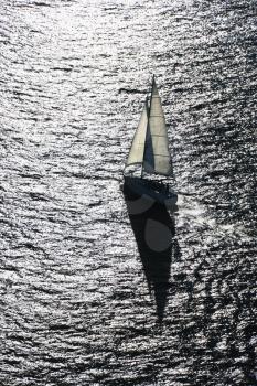 Royalty Free Photo of an Aerial View of a Back Lit Sailboat in Sydney, Australia