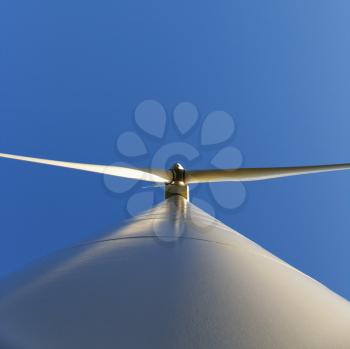 Royalty Free Photo of a Wind Turbine Against a Blue Sky