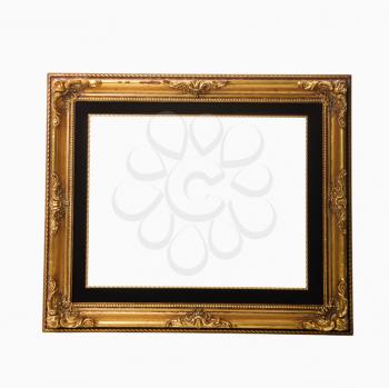 Empty gold colored fancy picture frame.