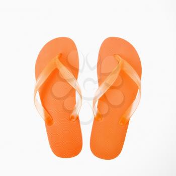 Orange plastic thong flip flops.