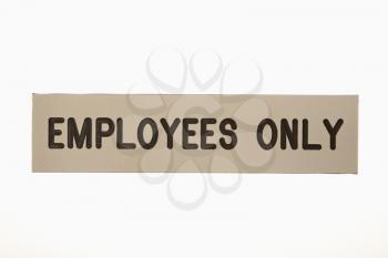 Employees only sign against white background.