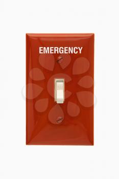 Red emergency switch plate with switch in off position.