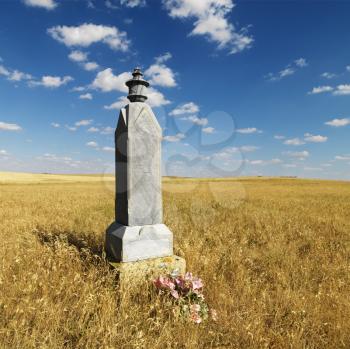 Royalty Free Photo of a Stone Burial Monument in a Field