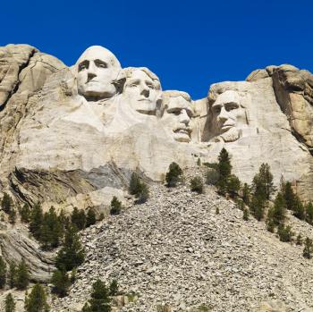 Royalty Free Photo of Mount Rushmore National Memorial with Mountain and Trees