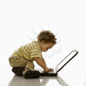Royalty Free Photo of a Toddler Boy Using a Laptop