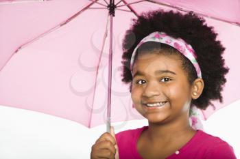 Royalty Free Photo of a Smiling Girl Holding a Pink Umbrella