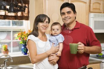 Royalty Free Photo of a Family Portrait in a Home Kitchen