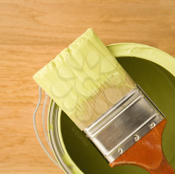 Royalty Free Photo of a High Angle View of a Paintbrush Resting on a Paint Can