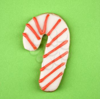 Royalty Free Photo of a Candy Cane Sugar Cookie With Decorative Icing