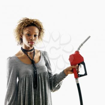 Royalty Free Photo of a Woman Holding a Fuel Pump Nozzle