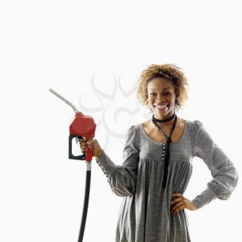 Royalty Free Photo of a Woman Holding a Fuel Pump Nozzle